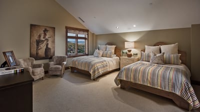 Bedroom with two queen beds and twin bunk beds