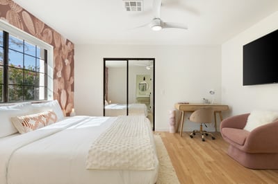 Guest bedroom 4 in the main house with king bed, reach in closet and en suite