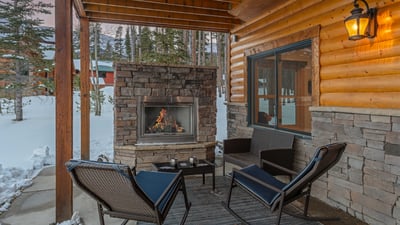 Warm up by the outdoor fireplace on the lower level patio