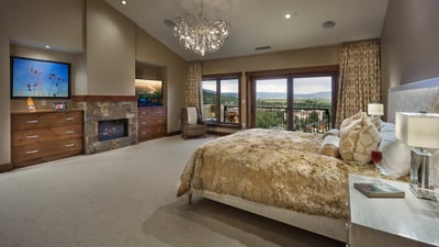 Primary suite with fireplace, TV and balcony access