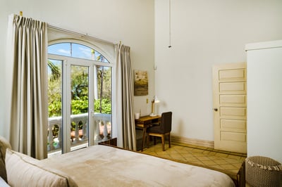 #4 Oceanview Master suite – King Bed, Private Balcony, AC, and a Smart TV.
