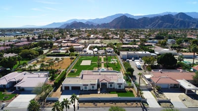 Expansive 1.0 acre yard with resort-style amenities: large pool/spa, sand volleyball, putting green,