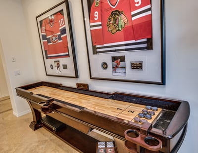 Fun game room with shuffle board, game table, arcade games, monopoly, chess and poker!