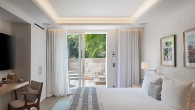 Bedroom 3: Located on the main level in a separate cottage. King size bed, air conditioning, ceiling