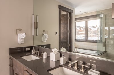 Step into your luxurious ensuite with dual vanities, a soaking tub, and glass shower—perfect for unw