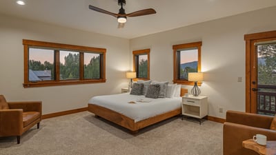 Primary king suite on the main level with private balcony access