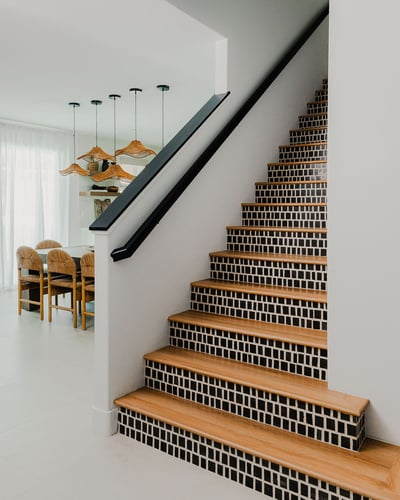 Gorgeous staircase leading up to five additional bedrooms and two full bathrooms.
