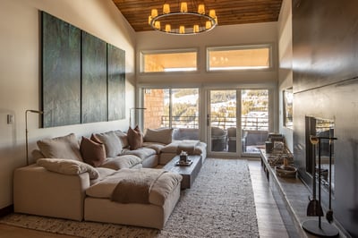 Sink into this luxurious sectional while enjoying stunning mountain views through floor-to-ceiling w