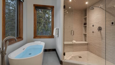Primary ensuite with tub and steam shower