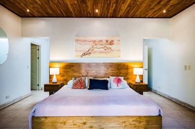 Experience luxury sleep in our #2 Oceanview Master suite – King-Bed, AC, a smart TV, and even your o