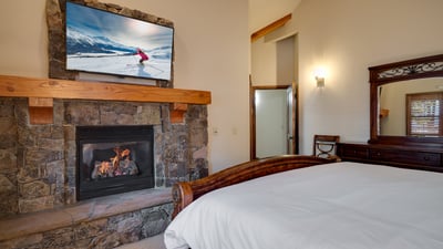 King suite on upper level with fireplce