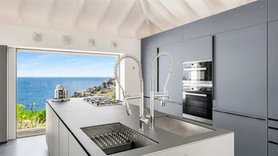 Kitchens: Two state of the art kitchens by Valcucine, renowned for its high technology and environme