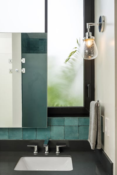 - Sleek counter space and polished chrome fixtures give this vanity a modern edge
- Look out to trop