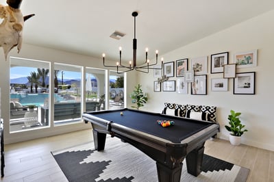 Game room with pool table that also converts to a ping pong table.