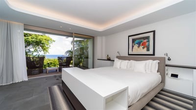 Bedroom 2: On an upper level. This room is accessed from the outside. King size bed, air condit