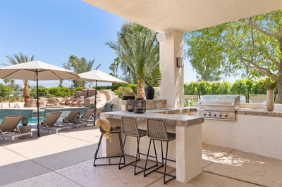 Grill and outdoor fridge.