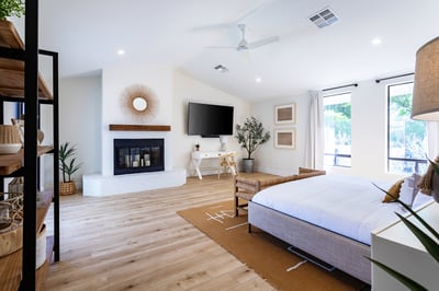 Primary bedroom with king bed, writing desk, TV and seating area. Direct access to the front pool.