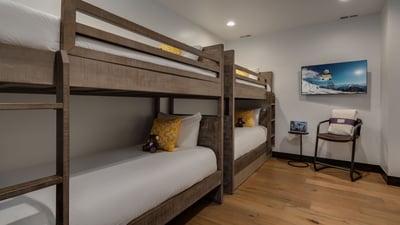 Lower level fun bunkroom with TV