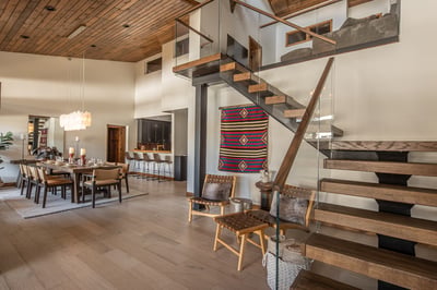 Your modern mountain retreat features soaring wood-beam ceilings and an open-concept design where yo