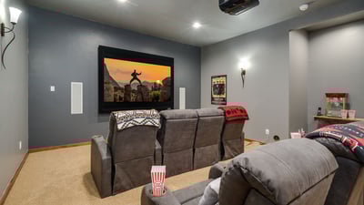 Grab some popcorn and watch a movie in the theater room!
