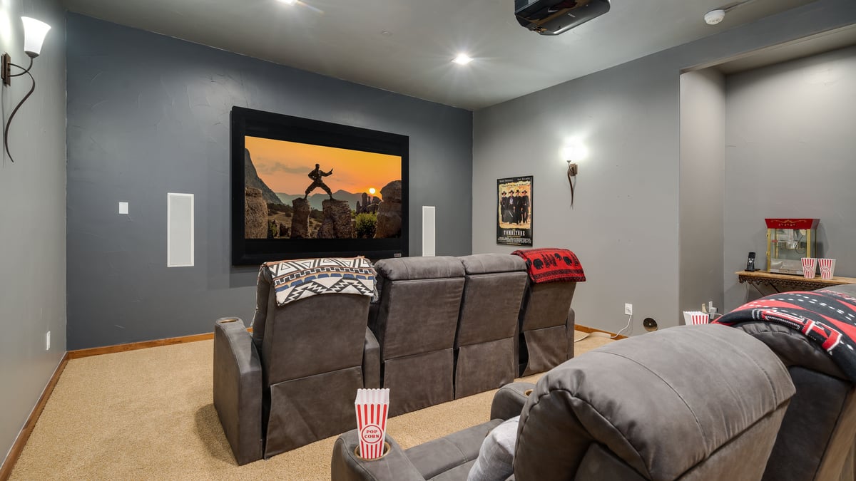 Grab some popcorn and watch a movie in the theater room! - Image 23