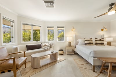 Quartz: Primary bedroom on the second floor with a cozy seating area